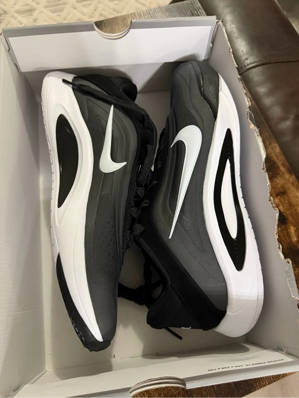 Nike Men's Black and White Running Shoes with Swoosh Accent